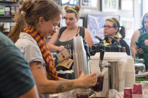 A Scribbles employee prepares coffee as she tends to the dozens of other customers waiting in a line, which extended out the door, for Harry Potter themed drinks during Potterfest on Saturday, July 29, 2017.