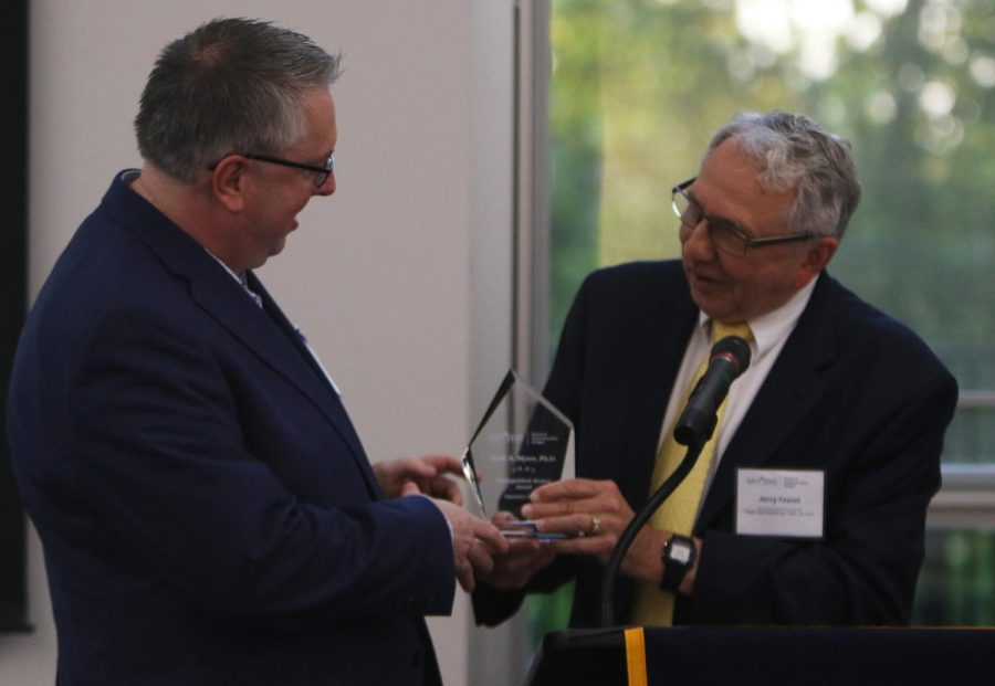 Scott A. Myers, Ph.D., accepts the Distinguished Alumni Award during the Taylor Hall Reopening Celebration on Friday, Sep. 22, 2017.