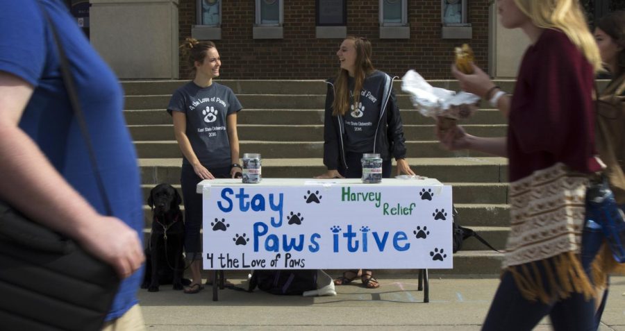 Seniors Aleah Burris and Mackenzie Nekl stand outside the MACC Center on Sept. 12, 2017 and collect donations for Austin Pets Alive, a shelter in Austin affected by Hurricane Harvey. 