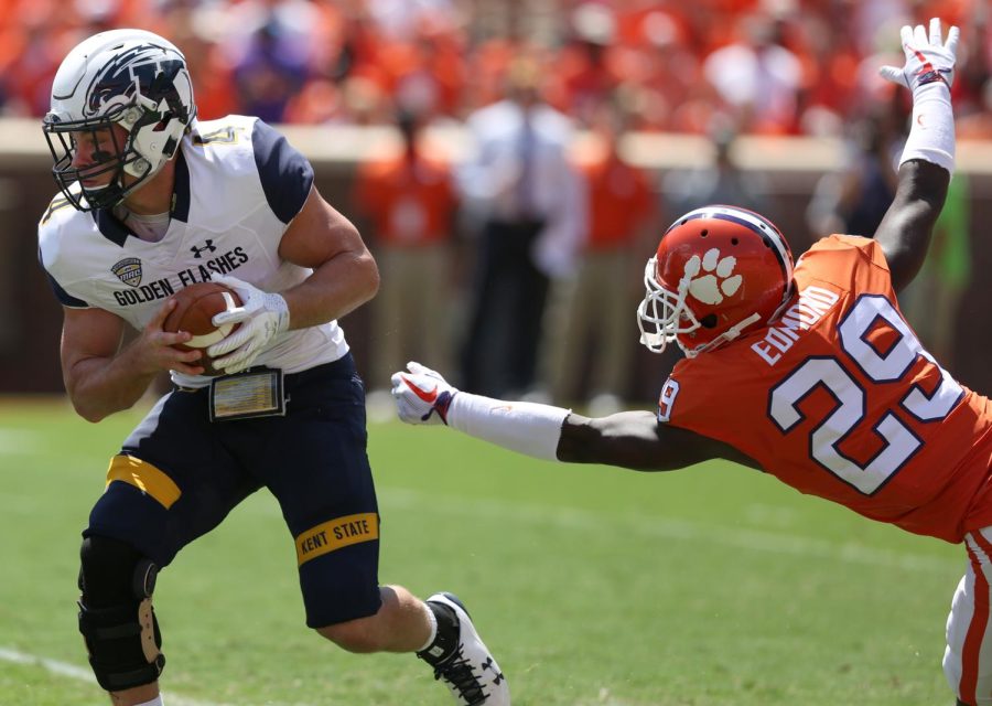 Kent State quarterback Nick Holley dodges a tackle in the first half of Kent States matchup against No. 5 Clemson.