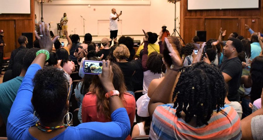 Audience members cheer as film entertainer KevOnStage performs during The Remedy, hosted by Impact Movement in the Schwartz Center Auditorium on Saturday, Sept. 16, 2017.