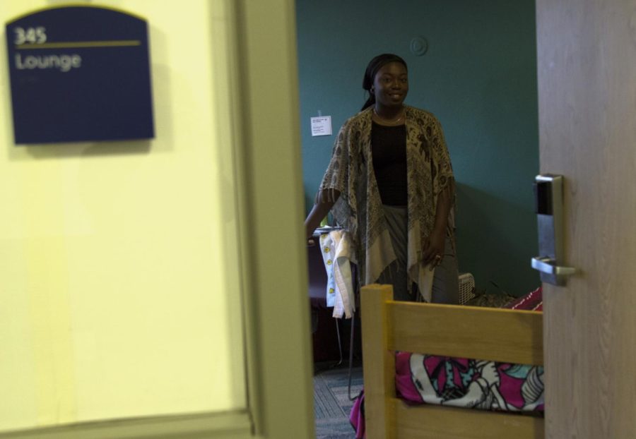 Teresa Crum, a sophomore criminology and justice studies major, stands in the lounge on her floor, which is serving as her temporary dorm room.