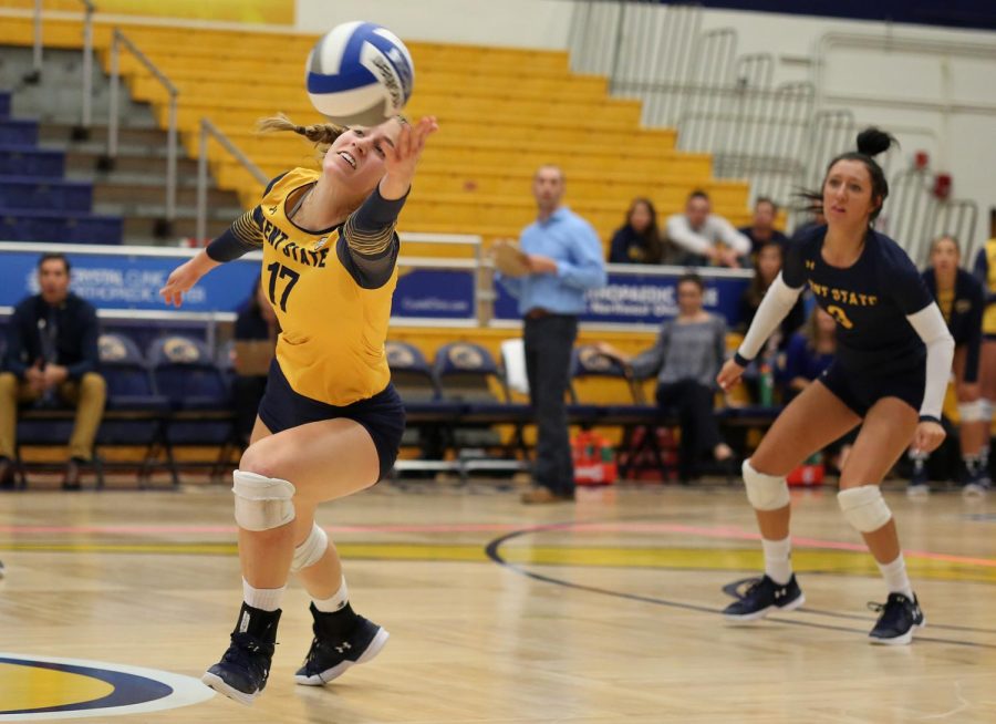 Kent State senior Kelsey Bittinger hits the ball while senior Challen Geraghty watches during the Homecoming match Saturday, Oct. 14, 2017.