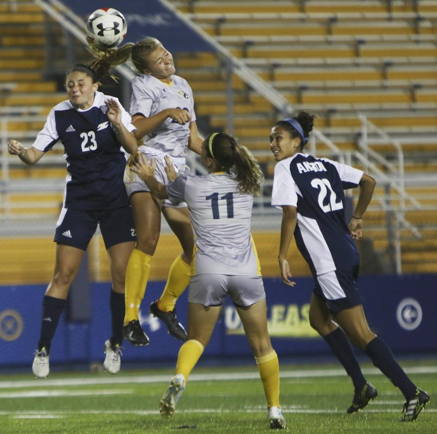 Kent State forward Cameron Shedenhelm heads the ball forward in the second period against the Akron Zips at Dix Stadium on Thursday, Oct. 5, 2017. The Flashes beat the Zips 3-0.