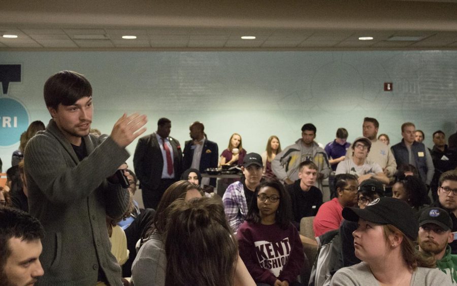 Joshua Budd, a sophomore integrated social studies major, asks a question to the panelists at the KENTtalks panel on free speech in the Tri-Towers Rotunda Wednesday, Oct. 18, 2017.