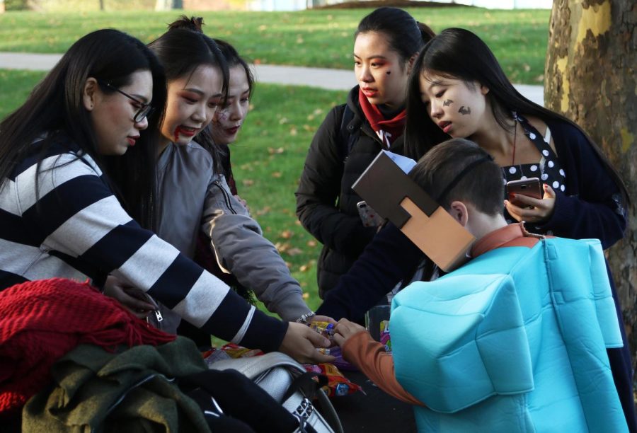 Students studying abroad at Kent State Stark hand out treats to children during the BooU Event at Stark on Thursday, Oct. 26, 2017. This was the first Halloween for many international students studying at Stark this semester.