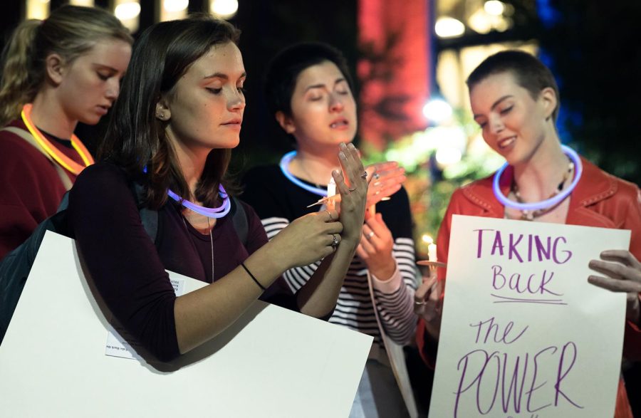 Students hold candles and sing “This Little Light of Mine” during the Take Back the Night event for sexual abuse and violence awareness on Oct. 1, 2017.