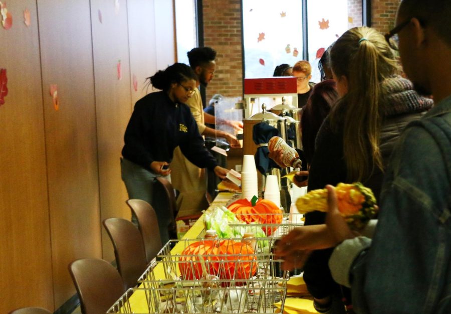 Students wait for popcorn during the Fall Festival which was moved to the Student Center due to poor weather on Oct. 11, 2017.