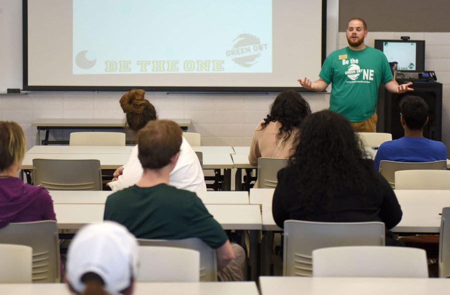 Sven Rundman, the project coordinator of Sexual and Relationship Violence Support Services, discusses the Green Dot program with students at an event in the Twin Towers Friday, Oct. 27, 2017.