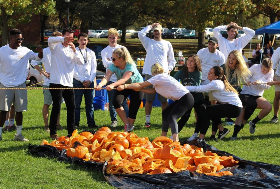 Members of Delta Zeta play tug-of-war during the Pumpkin Bash event on Manchester Field Sunday, Oct. 22, 2017.