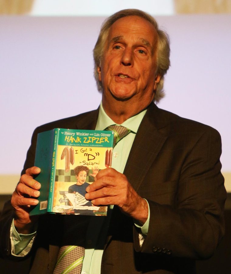 Henry Winkler, actor and writer, prepares to read a passage from “I Got “D” in Salami,” during his lecture at Kent State University Stark Campus on Tuesday, Oct. 10, 2017. The book is a part of Winkler’s “Hank Zipper” series, which follows the life of Hank Zipper, a child with Dyslexia. Winkler was diagnosed with dyslexia at 31.