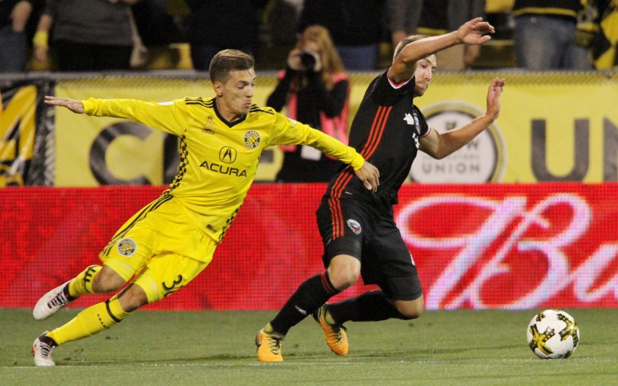 D.C. United midfielder Russell Canouse steals the ball from Columbus Crew midfielder Pedro Santos during a match in Columbus, Ohio, on Saturday, Sept. 30, 2017.