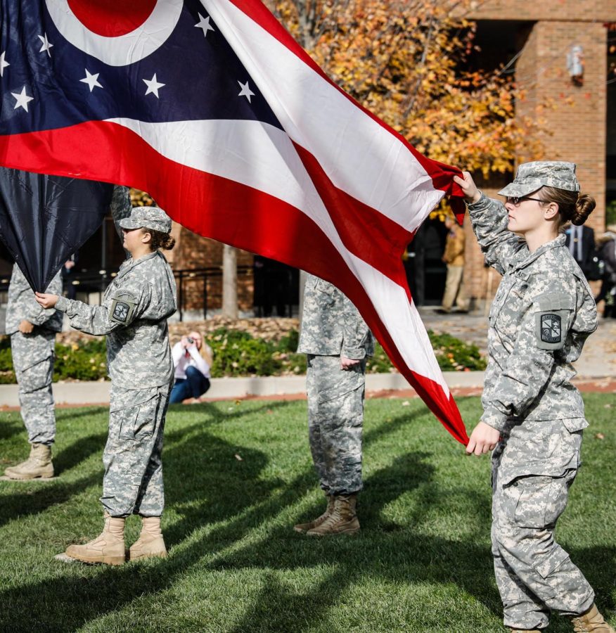 Members of the Air Force ROTC and Army ROTC Color Guard raise flags during Veterans Day Ceremonies Thursday, Nov. 9, 2017.