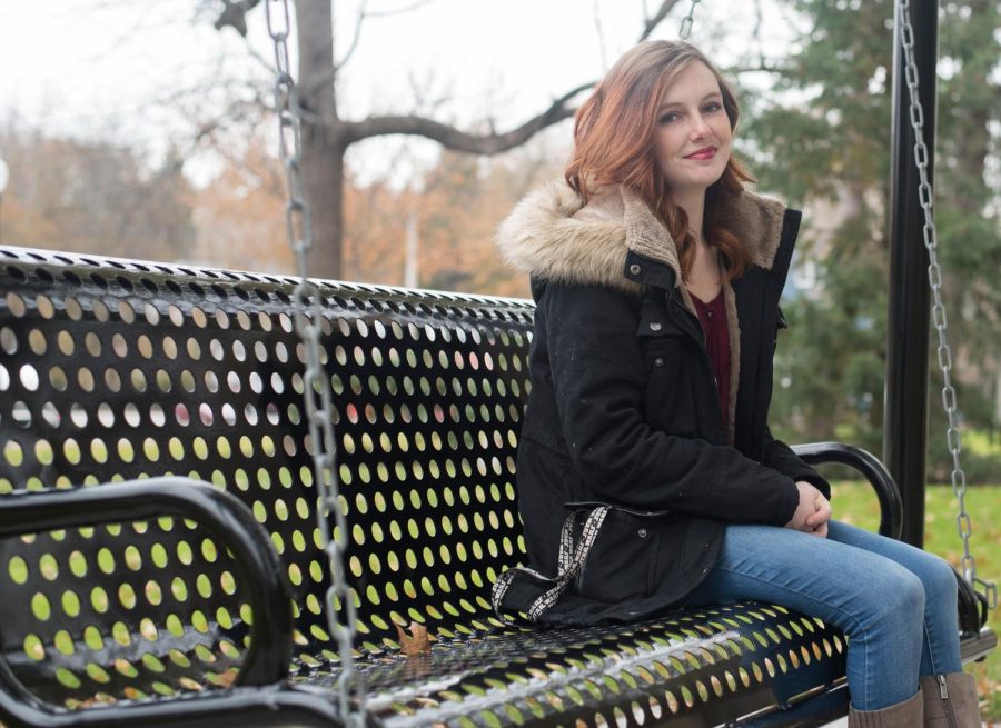 Erica Mohler sits on the swing Wednesday, Nov. 15, 2017, she hopes to dedicate to her deceased friend, Taylor Pifer. So far, $3,000 of the $5,000 needed to dedicate the swing has been raised.