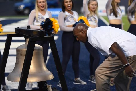 Kent State coach Paul Haynes rings the victory bell after a 17-14 win against Miami (OH) Saturday, Oct. 14, 2017.