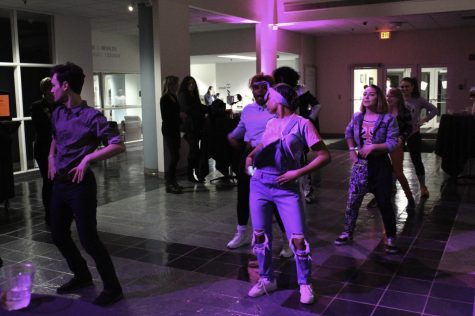 Students dance at the 80s-themed Kent State University Museum exhibition held in Rockwell Hall Friday, Nov. 3, 2017.