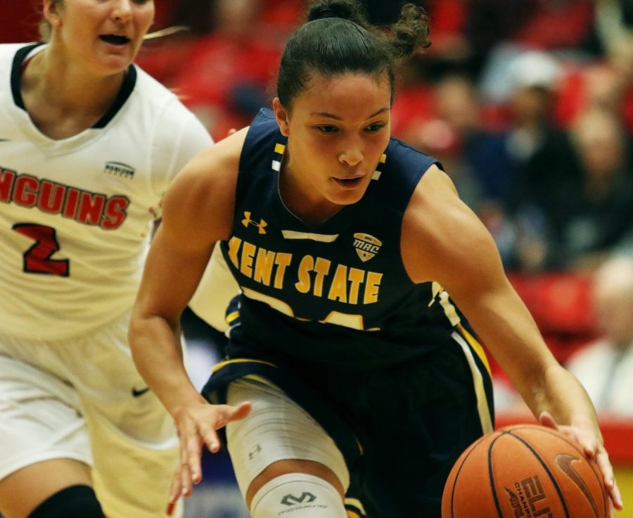 Kent State guard Alexa Golden dribbles the ball past Youngstown State guard Alison Smolinski.