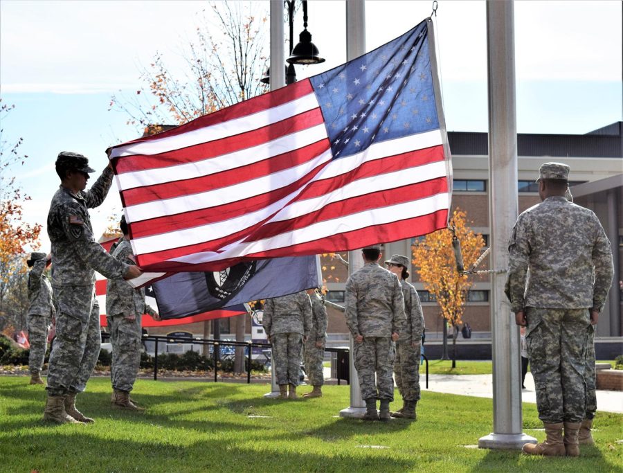 Members of Kent State’s Army ROTC and Air Force ROTC programs perform a flag-raising ceremony on the Student Green at Risman Plaza during Kent State’s observance of Veterans Day Thursday, Nov. 9, 2017.