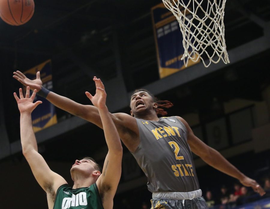 Kent State freshman forward BJ Duling jumps for a rebound over an Ohio defender Friday, Jan. 12, 2018. Kent State won the game, 70-69. 