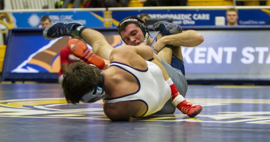 Junior Anthony Tutolo gets trapped in a hold from Old Dominion’s Caleb Richardson in the second match Wednesday, Feb. 9 at the M.A.C. Center. [FILE]