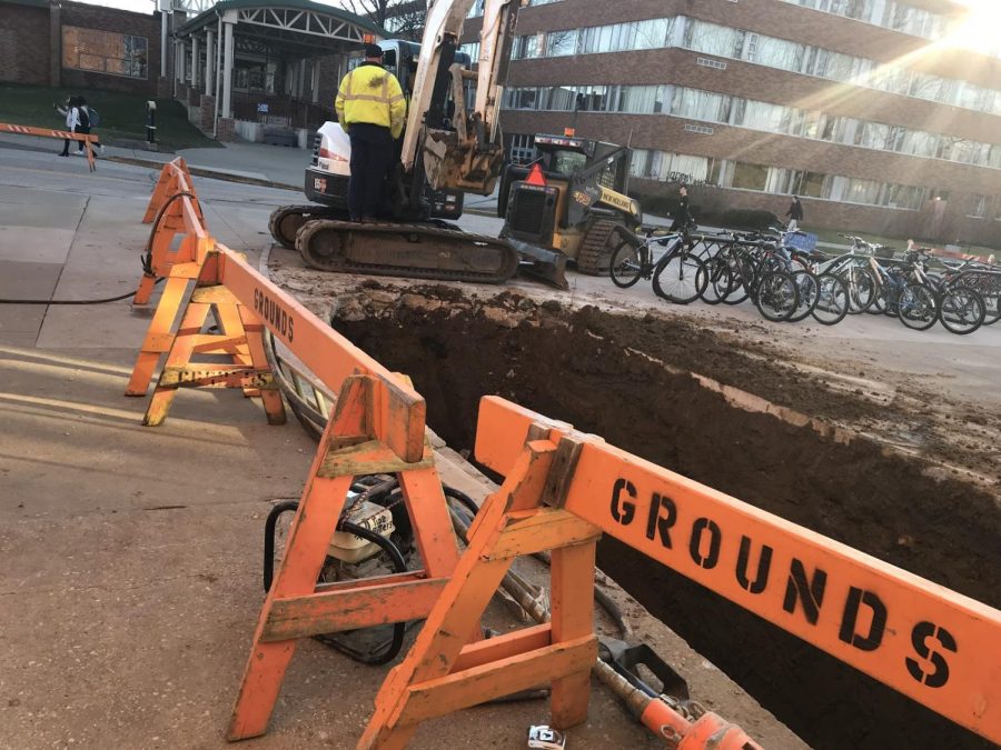 A massive hole dug outside of Korb Hall leads to the broken sewer line on Feb. 26, 2018.