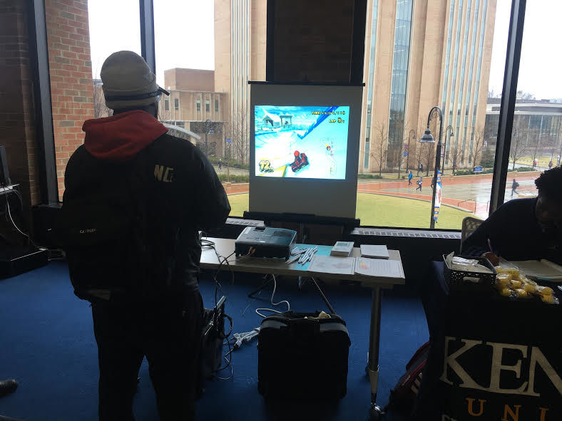 A student playing Mario Kart while wearing goggles that mimic intoxicated vision during Kent Polices distracted driving event on Thursday. 