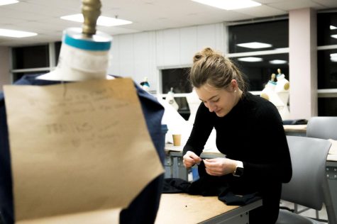 Liquid crystal design student Tanya Lopatkina sews a jacket design that can convert into a bag for Fashion Tech Hackathon in Rockwell Hall Saturday, Jan. 28, 2017. With little time for eating and sleeping, Fashion Tech Hackathon is a weekend long competition in which students from different schools team up as fashion designers and engineers to create wearable technology.