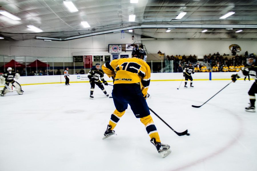 Kent State forward TJ West carries the puck through the offensive zone during the Flashes 9-2 victory over John Carroll on Friday, Jan. 19, 2018. [FILE]
