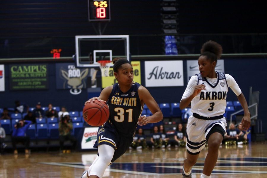 Sophomore guard Megan Carter drives to the hoop against Akron at James A. Rhodes Arena Saturday, Jan. 27, 2018. The Zips beat the Flashes, 75-60, for their first conference win of the season. [FILE]