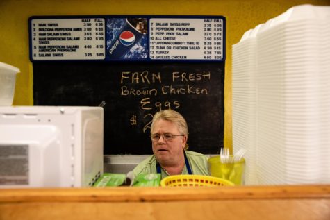 (1:51) Eric Morris prepares a sub for a customer in his shop Uptown Subs and Dogs on April 20, 2018. Eric has owned the shop for seven years. I like it. I know most of my customers by name. Its like a community, Eric said about the shop. Nathaniel Bailey/ The Kent Stater
