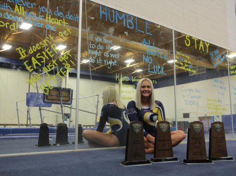 Rachel Stypinski poses with four of her Mid-American Conference gymnast of the year awards. 