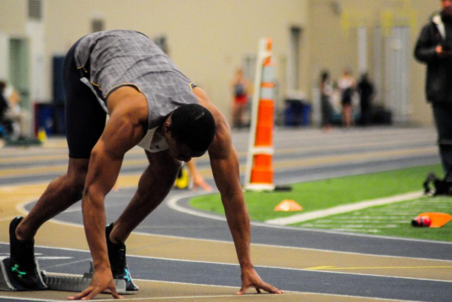 Kent State freshman sprinter Shaquille Perry lines up on the blocks as he prepares for his track event at the Northeast Ohio Quad in Akron on April 7, 2018. The Flashes won seven events on the weekend.