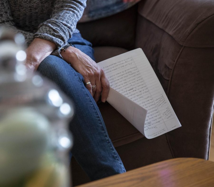 Anna Zsinko, 59, of Streetsboro, sits in her living room Sunday, holding her son’s writings. Matt died Aug. 29, 2015, of a heroin overdose after battling with the drug for six months, detailed in his writing.