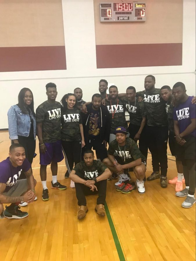 Brothers of Omega Psi Phi and friends at the basketball classic honor Devin Moore.