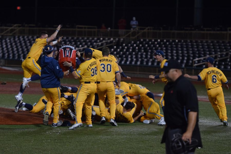 The Kent State baseball team jumps on top of senior pitcher Eli Kraus following the Flashes 14-0 win in the MAC Championship game on May 27, 2018. Kraus threw a two-hit complete game shutout, striking out 12. 