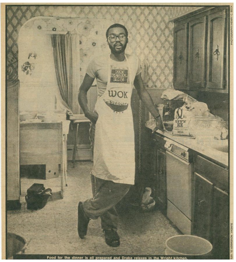 Uncle Mo stands in a kitchen after catering while wearing his “Kent Natural Foods” shirt in 1979.