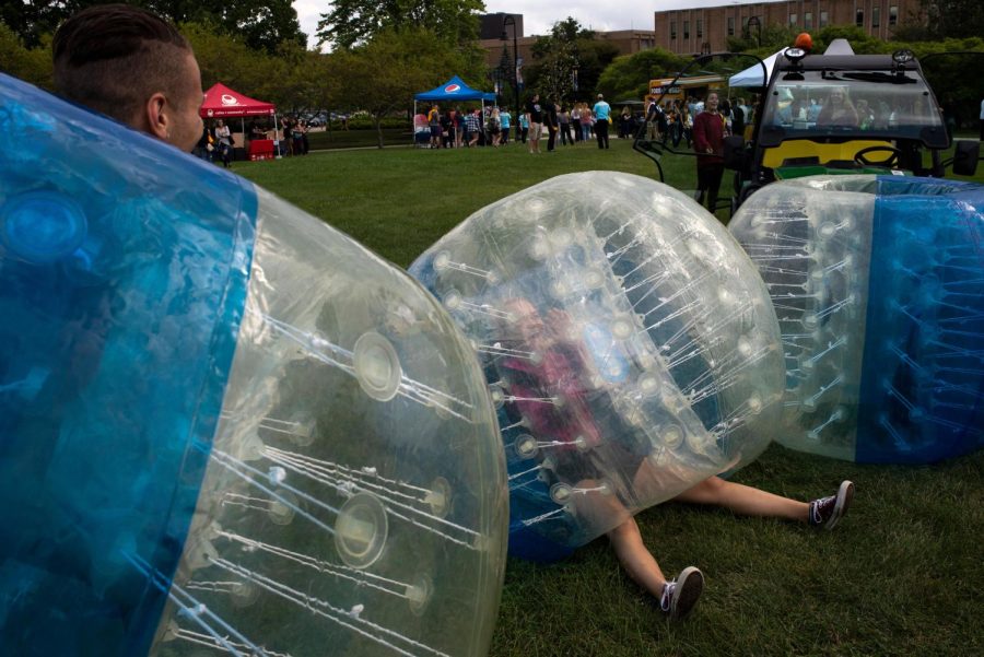 Freshman Kennedy Matty enjoys a game of bubble soccer with friends on Manchester Field on August 22, 2018. 