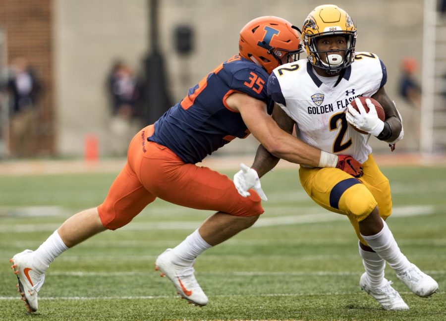 Illinois linebacker Jake Hansen tackles Kent State running back Will Mathews during the first half of the Flashes matchup against the Fighting Illini at Memorial Stadium in Champaign, Illinois on Sept. 1, 2018. The Flashes lost 31-24.