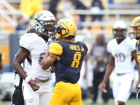 Kent State sophomore safety Elvis Hines exchanges words with Howard’s Mason Jordan after a tackle during the first quarter of their matchup Friday, Sept. 8, 2018. Kent State won, 54-14.
