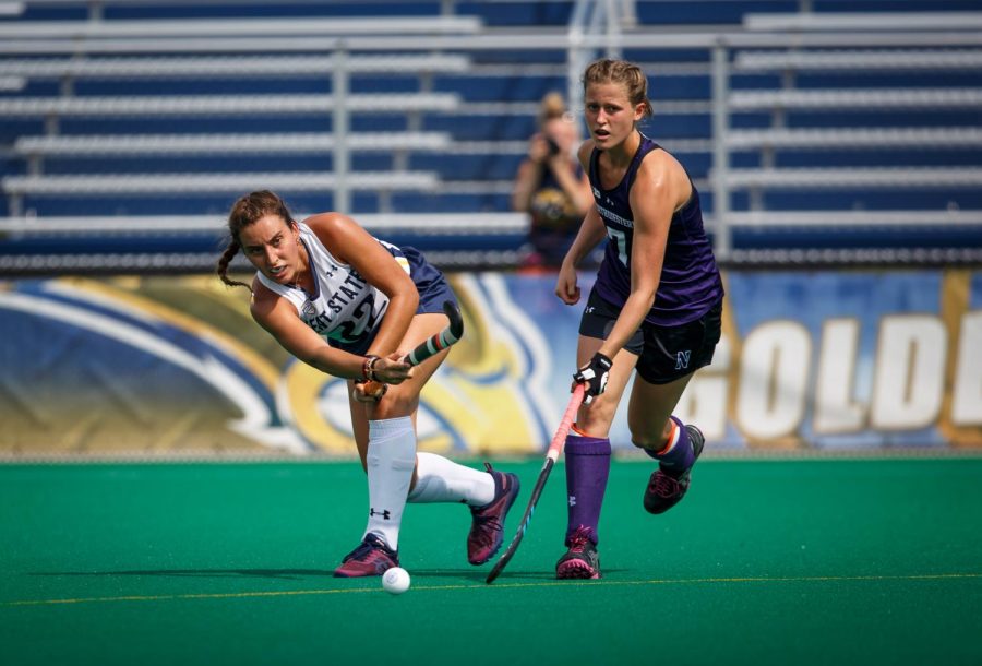 Freshman Helena Cambra Soler passes the ball during Kent State field hockey's match against Northwestern University on Sept. 4, 2018. Kent State lost 4-2.