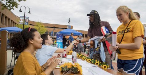 Students talk during the Black Squirrel Festival in Kent, Ohio on Friday, September 7, 2018.