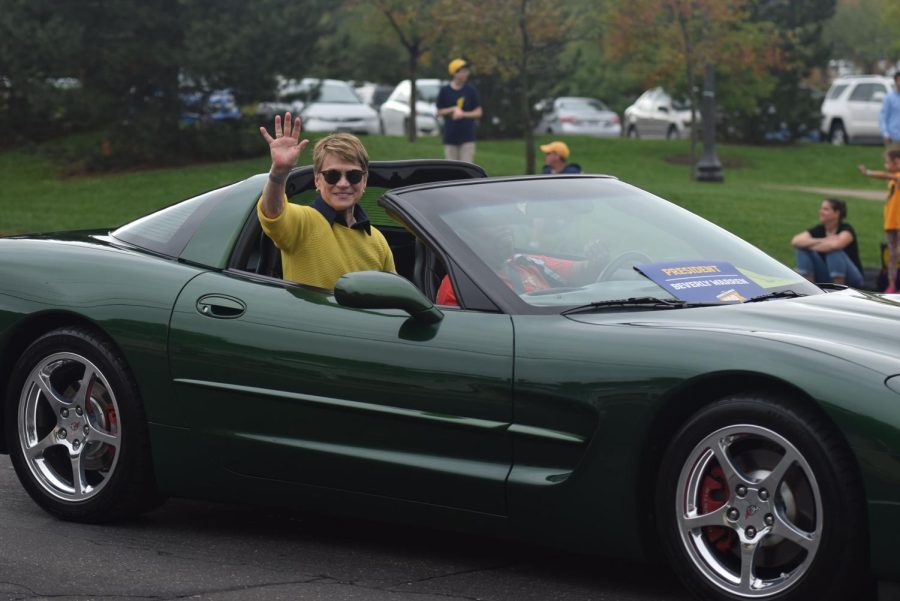 Kent State University president Beverly Warren waves to parade watchers on Oct. 6, 2018. 