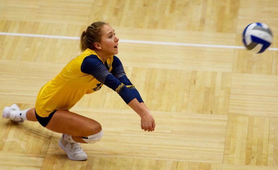 Sophomore Kaeleigh Stang makes the bump during the match against Purdue Fort Wayne on Friday Aug. 31, 2018. Kent State lost the match.