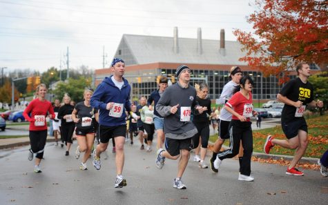 Participants in the Bowman Cup5k run take off from the Student Recreation and Wellness center on a crisp fall morning. The race kicks off homecoming day festivities.