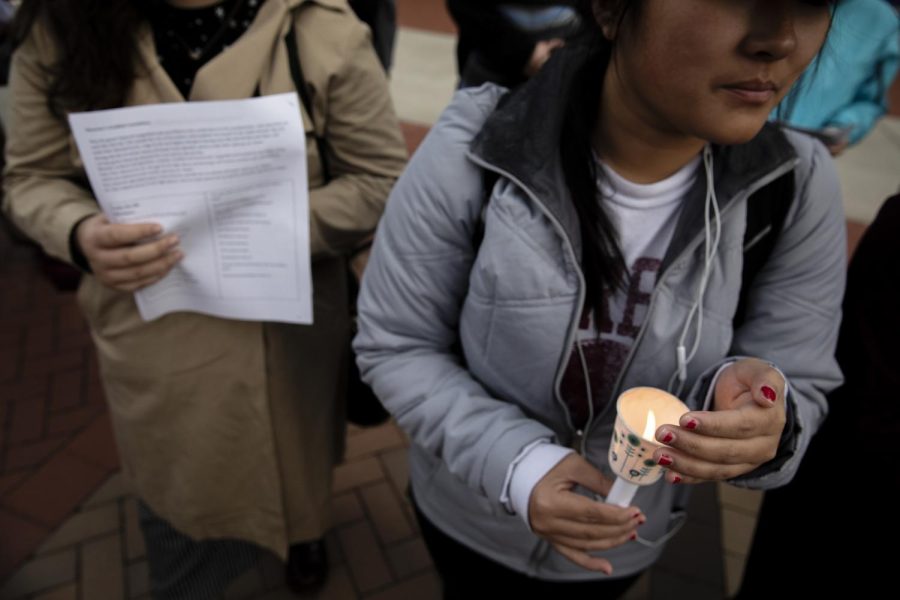 A student holds a candle during a vigil on Oct. 29, 2018 for the victims of the Pittsburghs Tree of Life synagogue shooting, where a gunman opened fire on worshipers. 