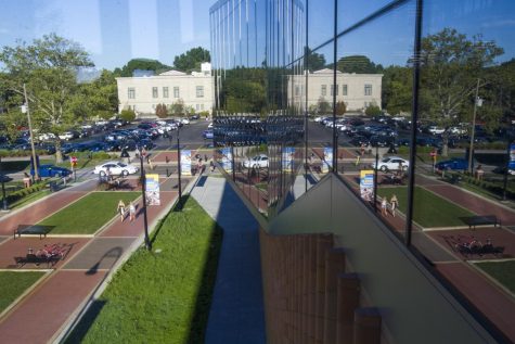The unique structure of the College of Architecture and Environmental Design building features extremely large windows, which create reflections of the Esplanade visible from one of many lounge areas overlooking campus. View from the CAED building on Monday, Aug. 29, 2016.