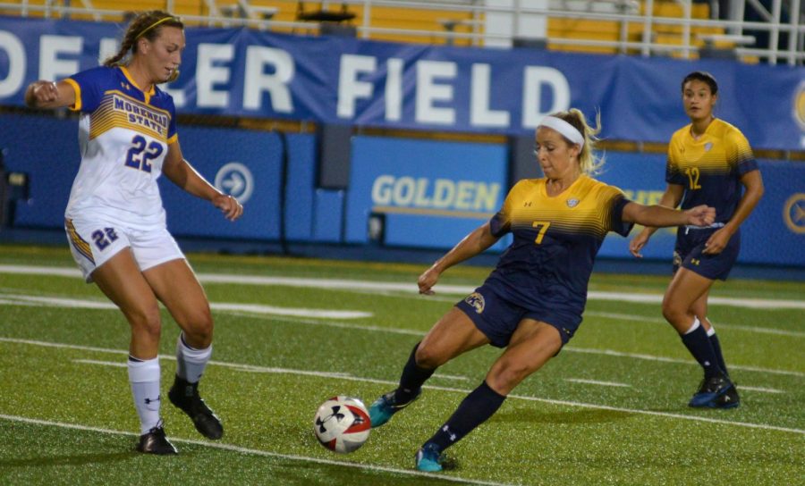 Kent State defender Yasmine Hall evades Morehead State defender Abby Timm during the second half of the Flashes matchup against Eagles. Hall recorded two goals in the Flashes three two victory on Sept. 7, 2018.
