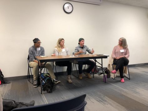 (Group student panel) Mack and service dog Merlin, Dever and Maclay sit at the student voices panel with moderator Dr. Laurie Wagner.