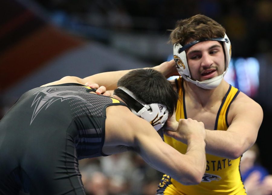 Kent State wrestler Anthony Tutolo grapples with Arizona States Ali Naser during the NCAA Wrestling Championships at Quicken Loans Arena on March 15, 2018. 