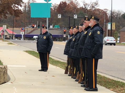 Kent veterans stand at attention during the playing of “America The Beautiful” during PARTAs Veterans Day ceremony on Monday, Nov. 12, 2018.